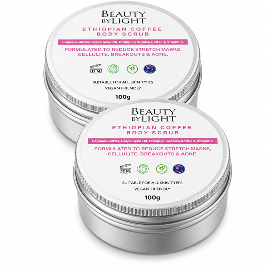 Two containers of Beauty by Light Ethiopian Coffee Body Scrub on a white background Beauty By Light Ethiopian Coffee Body Scrub 100g Twin Pack