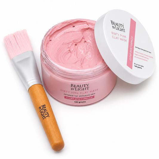 Pink clay mask with a brush and 'Beauty by Light' branding on a white background