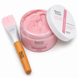 Pink clay mask with a brush and 'Beauty by Light' branding on a white background
